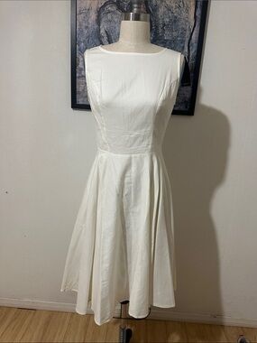 Elegant White Sleeveless Midi Dress with Flared Skirt